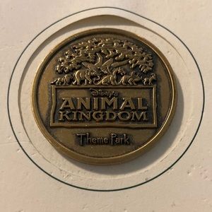1998 Disney’s Animal Kingdom commemorative coin on original backing 1.75”